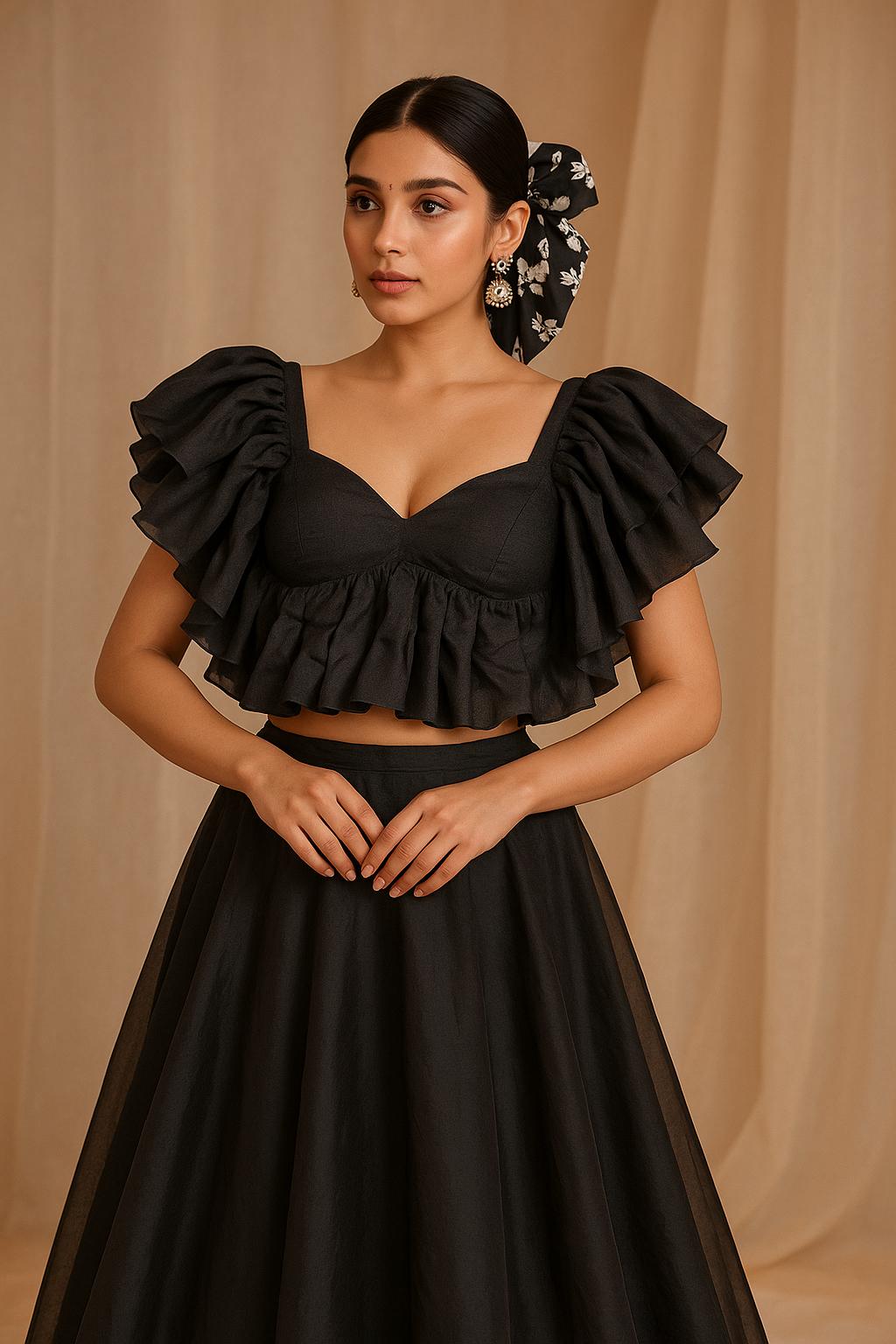 Woman wearing a black blouse with a beige background